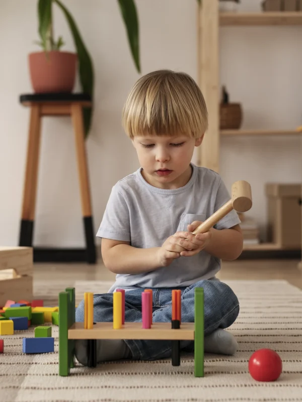 full-shot-child-playing-with-colorful-wooden-toys